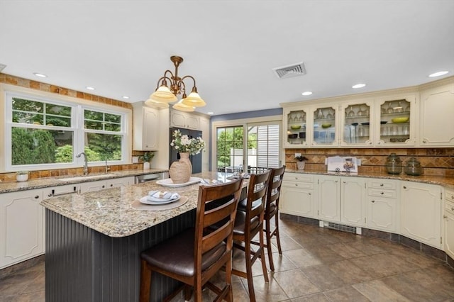 35 Crest Rd, Lynnfield, MA 01940 - kitchen with refrigerator, backsplash, a kitchen island, recessed lighting, and glass insert cabinets