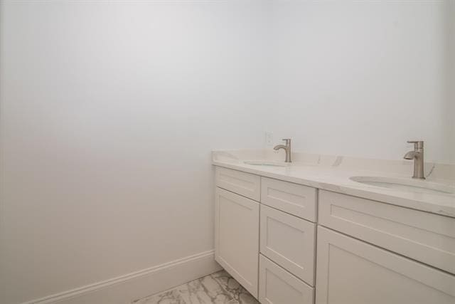 6 Carmel Rd, Pelham, NH 03076 - bathroom featuring marble finish flooring, baseboards, and double vanity