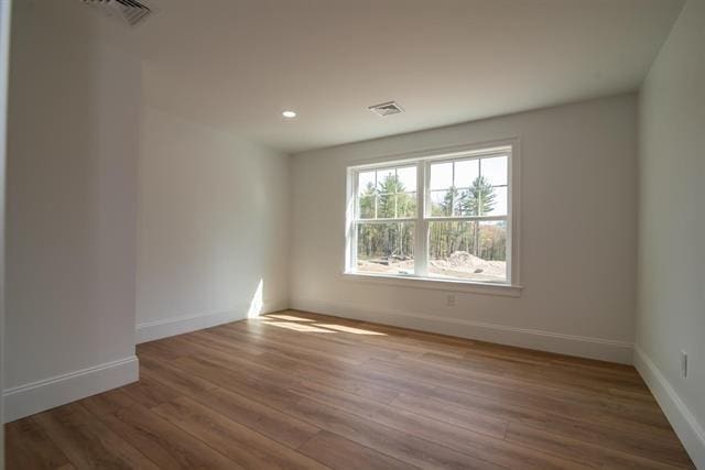 6 Carmel Rd, Pelham, NH 03076 - unfurnished room with baseboards, wood finished floors, and recessed lighting