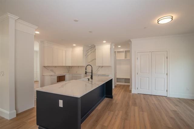 6 Carmel Rd, Pelham, NH 03076 - kitchen with light countertops, white cabinets, light wood-style floors, a sink, and recessed lighting