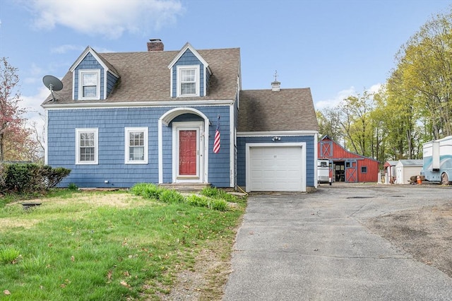 145 Lexington Rd, Billerica, MA 01821 - view of front of property featuring a garage, asphalt driveway, a chimney, roof with shingles, and a front lawn