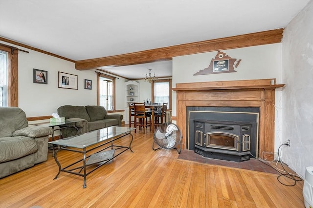 145 Lexington Rd, Billerica, MA 01821 - living area featuring wood finished floors, beamed ceiling, baseboards, and a chandelier