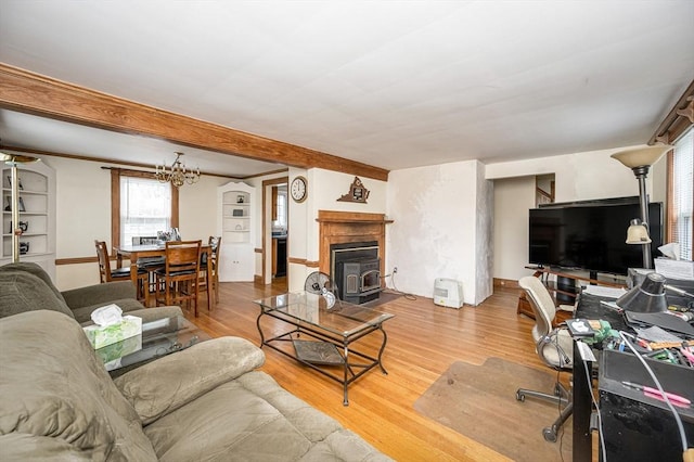145 Lexington Rd, Billerica, MA 01821 - living room with wood finished floors, beamed ceiling, and a chandelier