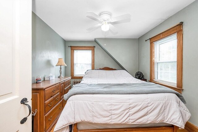 145 Lexington Rd, Billerica, MA 01821 - bedroom featuring multiple windows, radiator heating unit, and ceiling fan