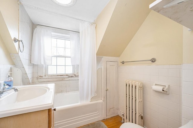 145 Lexington Rd, Billerica, MA 01821 - full bathroom with radiator, tile walls, shower / tub combo with curtain, vanity, and toilet