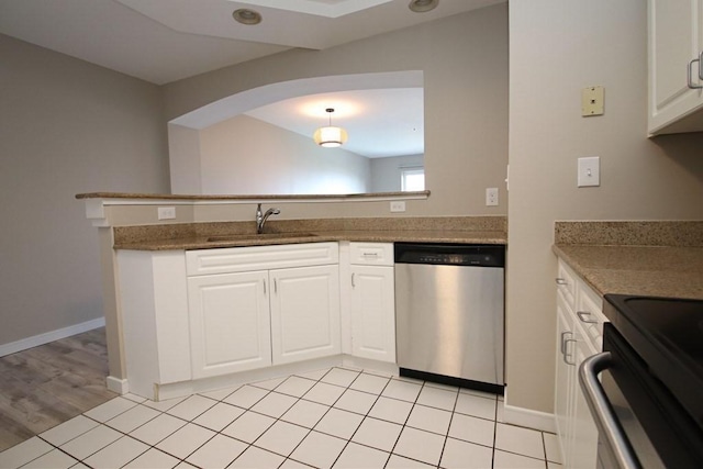 kitchen with white cabinetry, dishwasher, sink, light hardwood / wood-style flooring, and pendant lighting