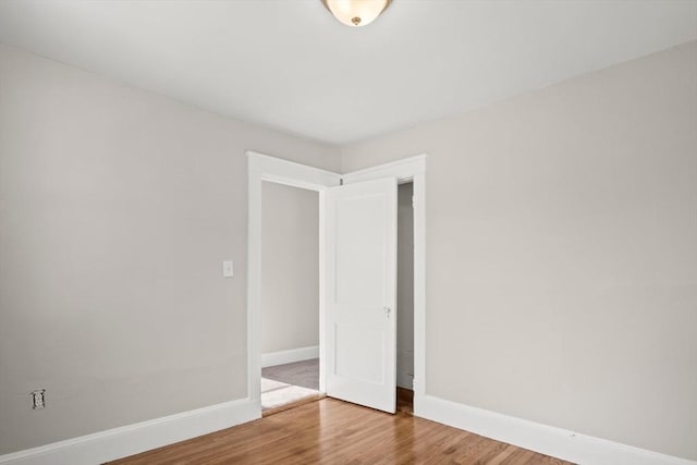 spare room featuring hardwood / wood-style flooring