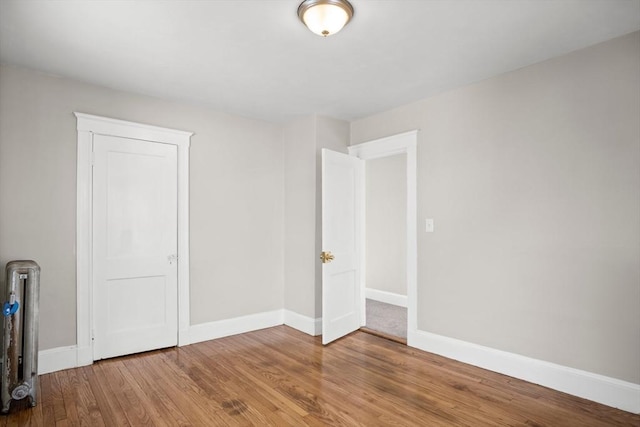 unfurnished bedroom featuring hardwood / wood-style floors