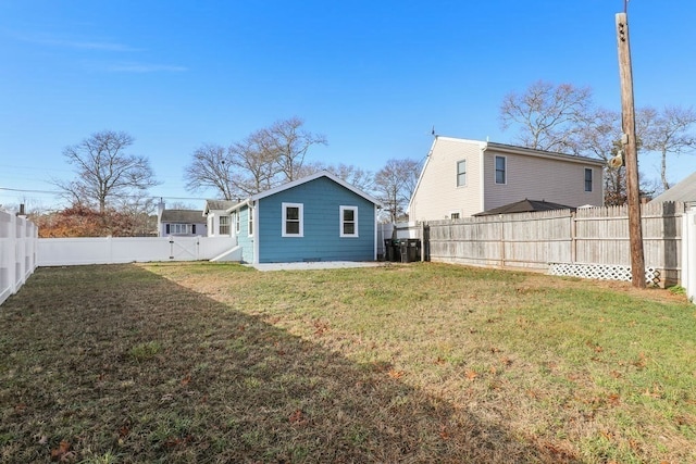 rear view of house with a lawn