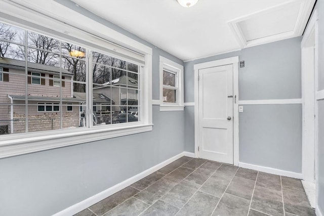 interior space featuring baseboards