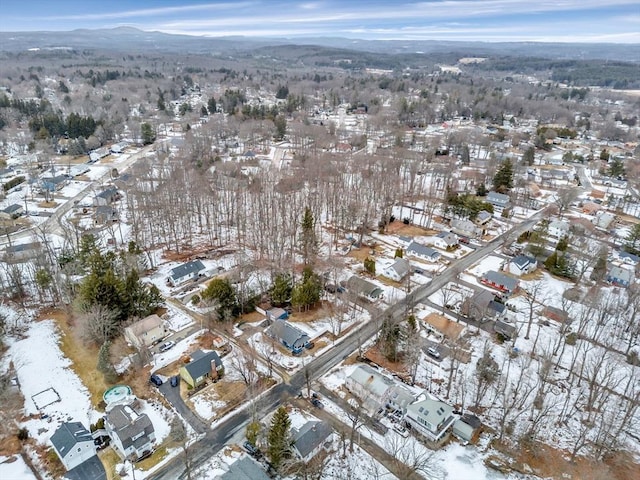 snowy aerial view with a residential view