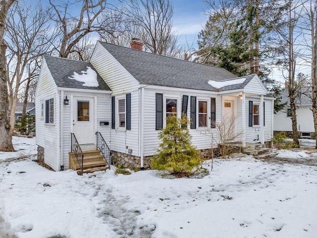 bungalow-style home featuring a shingled roof and a chimney