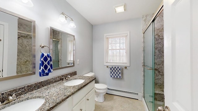 bathroom featuring a sink, a baseboard radiator, and a stall shower