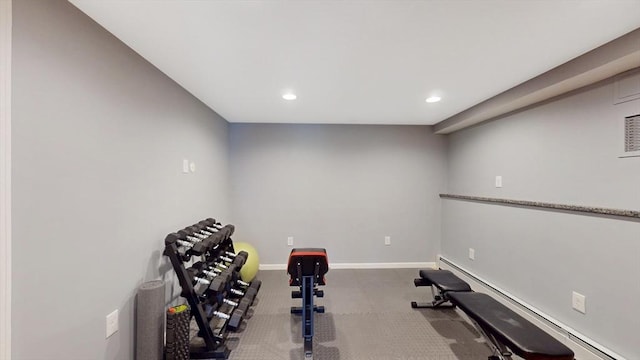 exercise room with baseboard heating, baseboards, recessed lighting, and carpet flooring