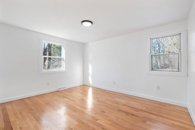 11 Adams St, Foxboro, MA 02035 - spare room featuring baseboards, light wood-type flooring, and visible vents