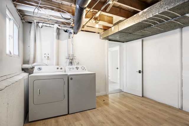 11 Adams St, Foxboro, MA 02035 - washroom with laundry area, light wood finished floors, and washing machine and dryer
