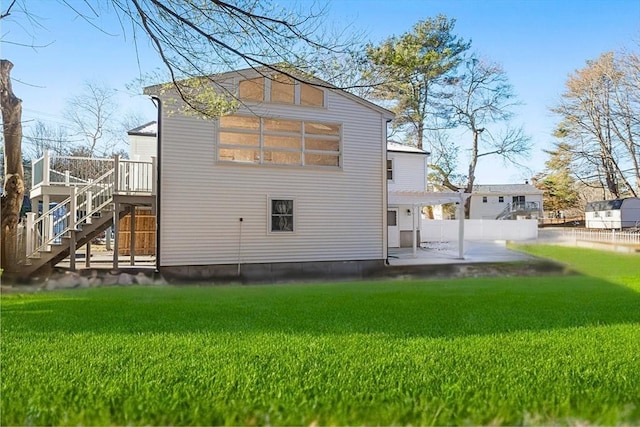 11 Adams St, Foxboro, MA 02035 - rear view of house with a wooden deck, a patio area, stairway, fence, and a yard