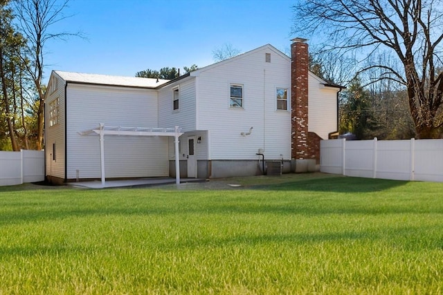11 Adams St, Foxboro, MA 02035 - back of house featuring fence, a pergola, a chimney, a patio area, and a yard