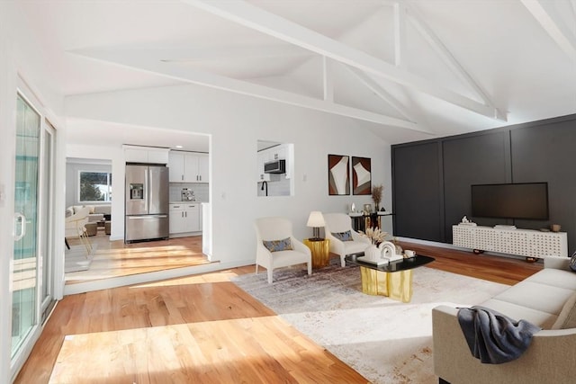 11 Adams St, Foxboro, MA 02035 - living room with beamed ceiling, high vaulted ceiling, and light wood-style floors