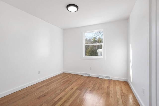 11 Adams St, Foxboro, MA 02035 - empty room featuring visible vents, light wood finished floors, and baseboards