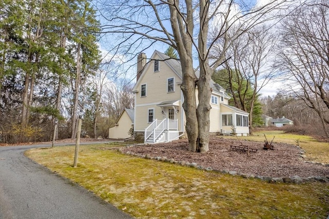 301 Old Billerica Rd, Bedford, MA 01730 - view of front of property with a chimney and a front yard