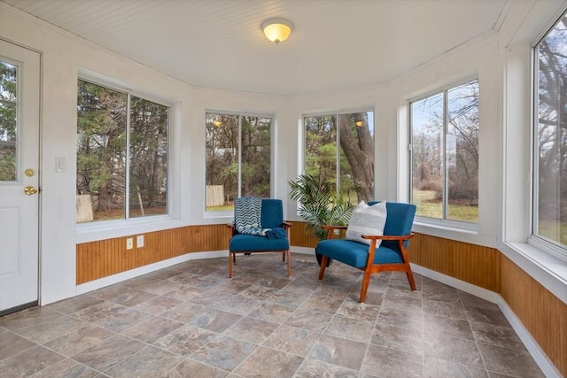 301 Old Billerica Rd, Bedford, MA 01730 - sunroom / solarium with healthy amount of natural light, stone finish floors, wooden walls, and baseboards