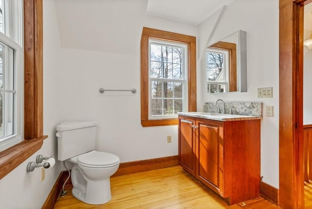 301 Old Billerica Rd, Bedford, MA 01730 - bathroom with hardwood / wood-style floors, baseboards, toilet, and vanity