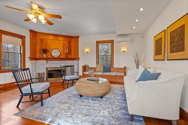301 Old Billerica Rd, Bedford, MA 01730 - living area with plenty of natural light, a wall mounted air conditioner, wood finished floors, a ceiling fan, and recessed lighting