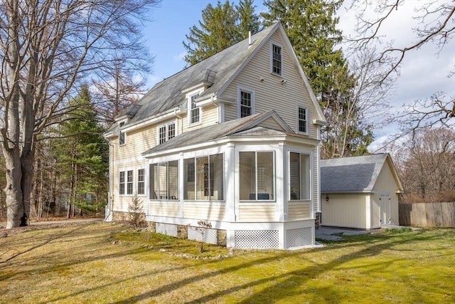 301 Old Billerica Rd, Bedford, MA 01730 - view of property exterior with a sunroom, roof with shingles, and an outdoor structure