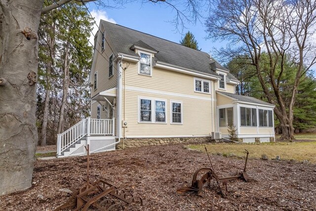 301 Old Billerica Rd, Bedford, MA 01730 - rear view of house with a sunroom