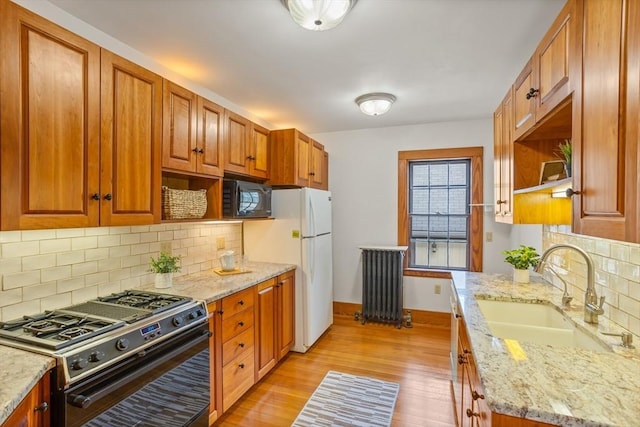 301 Old Billerica Rd, Bedford, MA 01730 - kitchen with gas range oven, open shelves, a sink, and black microwave