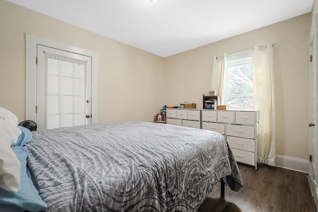 bedroom featuring dark hardwood / wood-style flooring