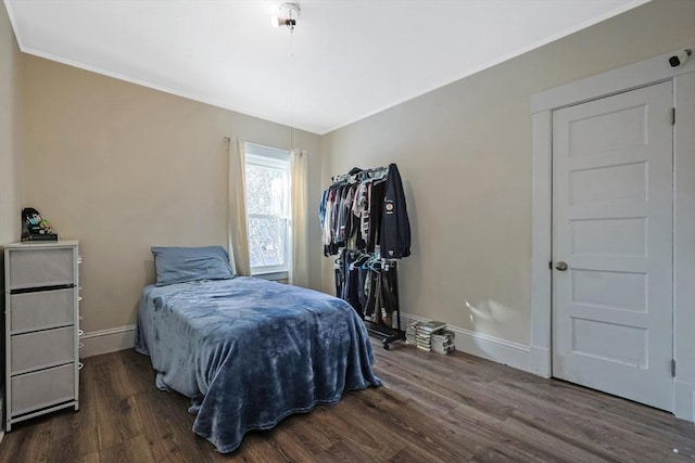 bedroom featuring dark hardwood / wood-style flooring