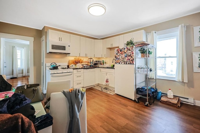 kitchen featuring light wood-type flooring, white cabinetry, and white appliances