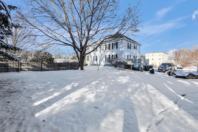 view of yard layered in snow