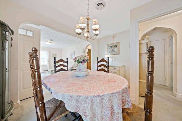 19 Oakdale Rd, Canton, MA 02021 - dining room featuring arched walkways, a chandelier, light carpet, and baseboards