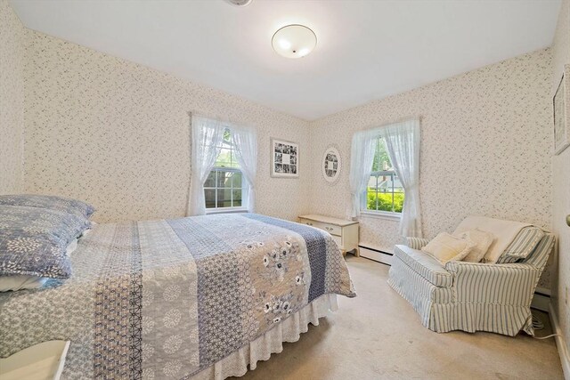 19 Oakdale Rd, Canton, MA 02021 - carpeted bedroom with multiple windows, wallpapered walls, and a baseboard radiator