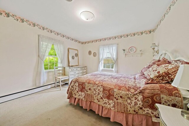 19 Oakdale Rd, Canton, MA 02021 - carpeted bedroom with multiple windows and a baseboard heating unit