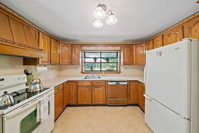 19 Oakdale Rd, Canton, MA 02021 - kitchen with white appliances, a sink, brown cabinetry, custom exhaust hood, and light countertops