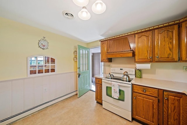 19 Oakdale Rd, Canton, MA 02021 - kitchen featuring white electric stove, a baseboard radiator, brown cabinets, light countertops, and a wainscoted wall