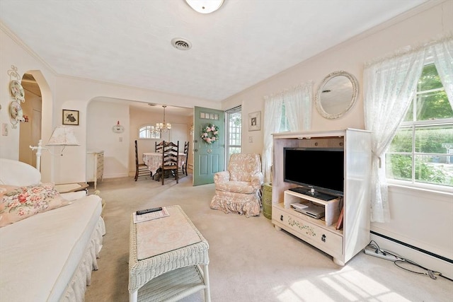 19 Oakdale Rd, Canton, MA 02021 - living room with a baseboard radiator, a chandelier, carpet floors, ornamental molding, and arched walkways