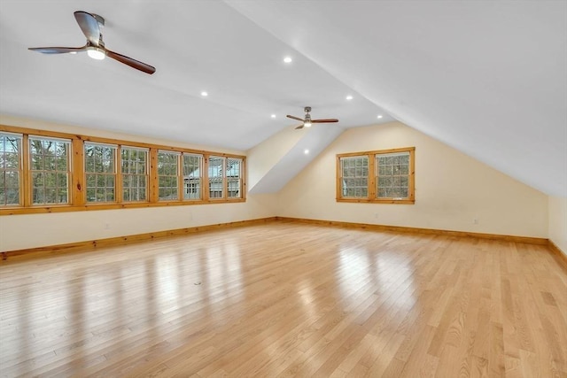 bonus room featuring lofted ceiling, ceiling fan, light wood-style flooring, recessed lighting, and baseboards