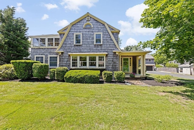 157 Branch St, Scituate, MA 02066 - rear view of house with a yard, a garage, and asphalt driveway