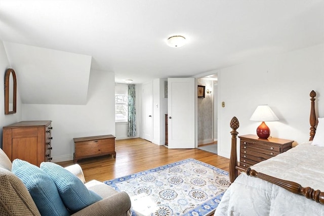 bedroom featuring baseboards and wood finished floors