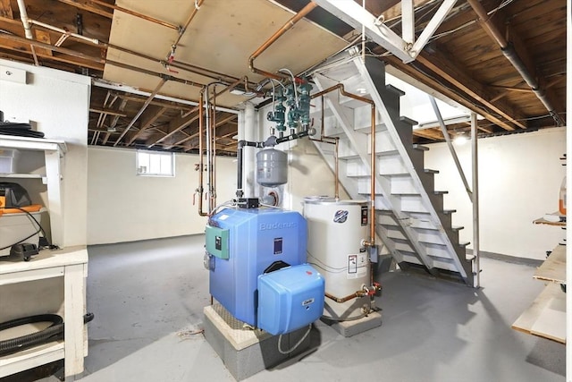basement featuring water heater and stairway