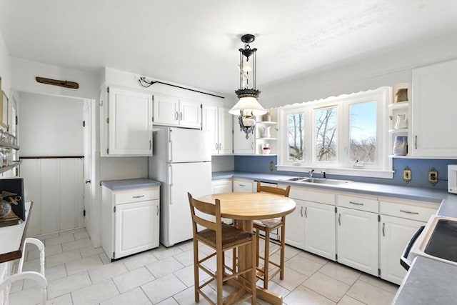 kitchen with white cabinets, open shelves, and white appliances