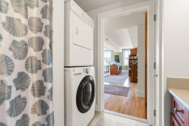 43 Park St Unit 15, Somerville, MA 02143 - washroom featuring stacked washer / drying machine and baseboards