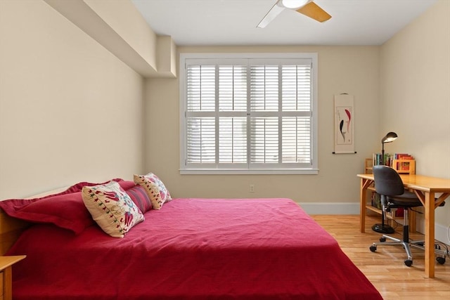 43 Park St Unit 15, Somerville, MA 02143 - bedroom with wood finished floors, multiple windows, baseboards, and an office area