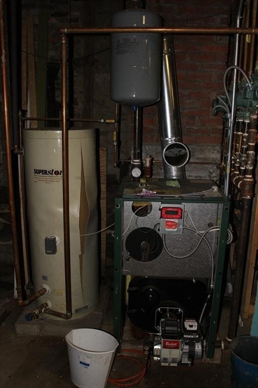 utilities featuring gas water heater and a heating unit