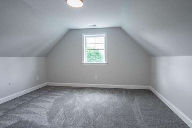 72 N Mast St Unit 1, Goffstown, NH 03045 - additional living space with carpet and vaulted ceiling